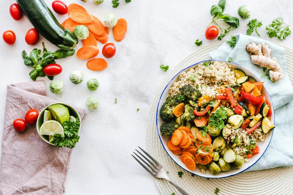 A healthy dinner bowl full of vegetables, protein, and yumminess