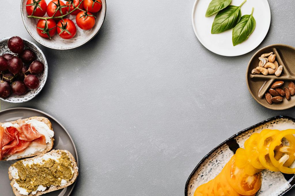 Dishes and plates full of seeds, nuts, vegetables, and whole grains—key foods of the Mediterranean diet.